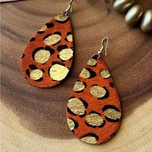 New, orange leopard felt earrings.